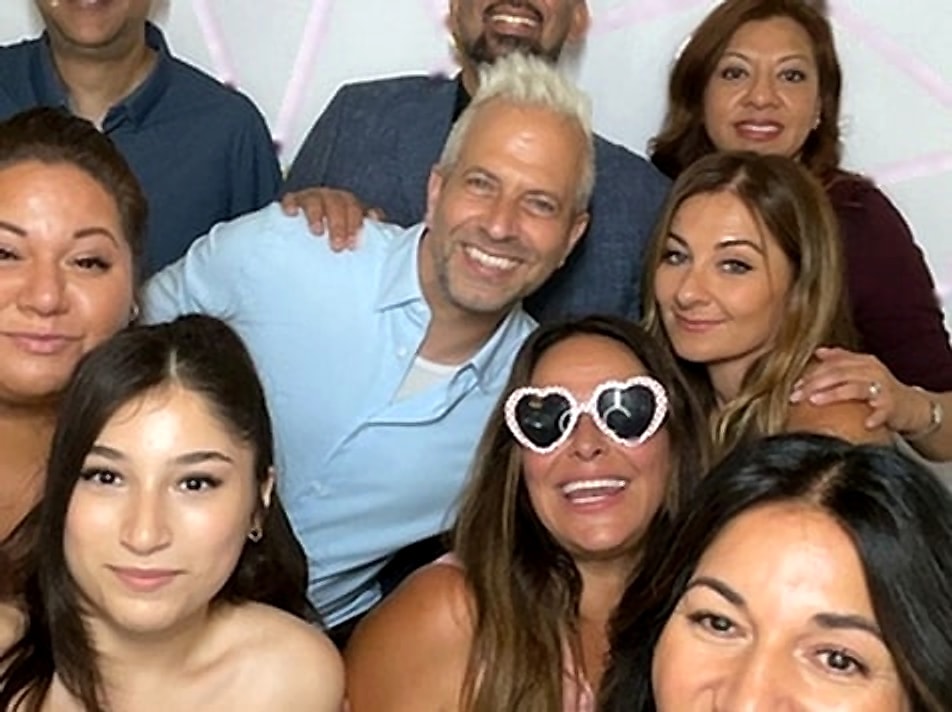 Family and friends squeezed together for a GLITZBX photo